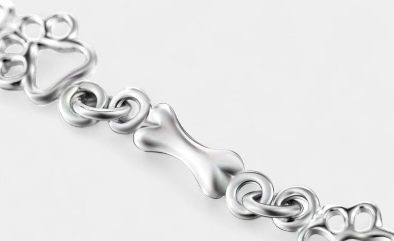 Virelle-Armband-Virelle | Dames armband – sterling zilver, pootafdruk- en botmotief, verfijnde schakelstructuur