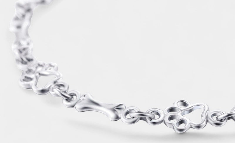 Virelle-Armband-Virelle | Dames armband – sterling zilver, pootafdruk- en botmotief, verfijnde schakelstructuur