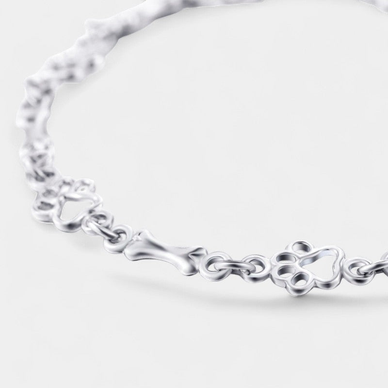 Virelle-Armband-Virelle | Dames armband – sterling zilver, pootafdruk- en botmotief, verfijnde schakelstructuur