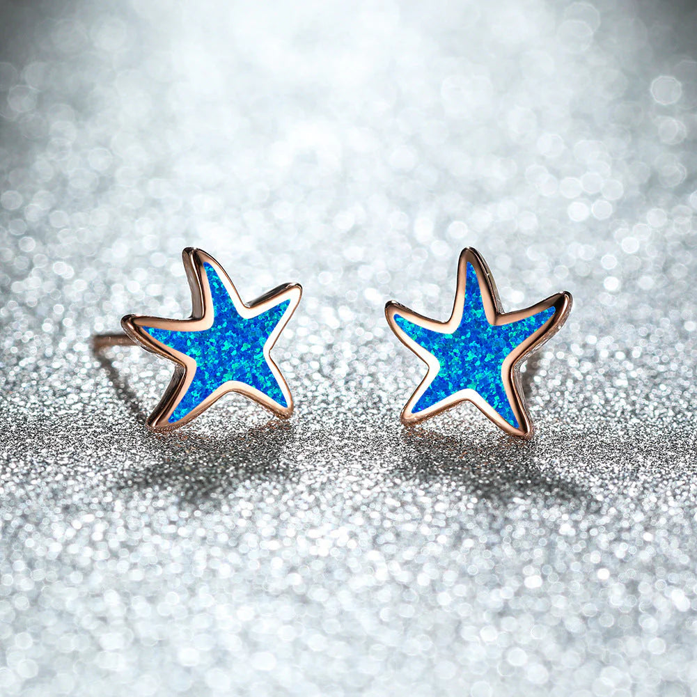 Virelle-Virelle | Damesoorbellen – Blauw opaal zeester-inleg, zilveren post